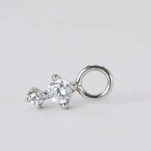 Dije charm dos Zirconias en plata (925)