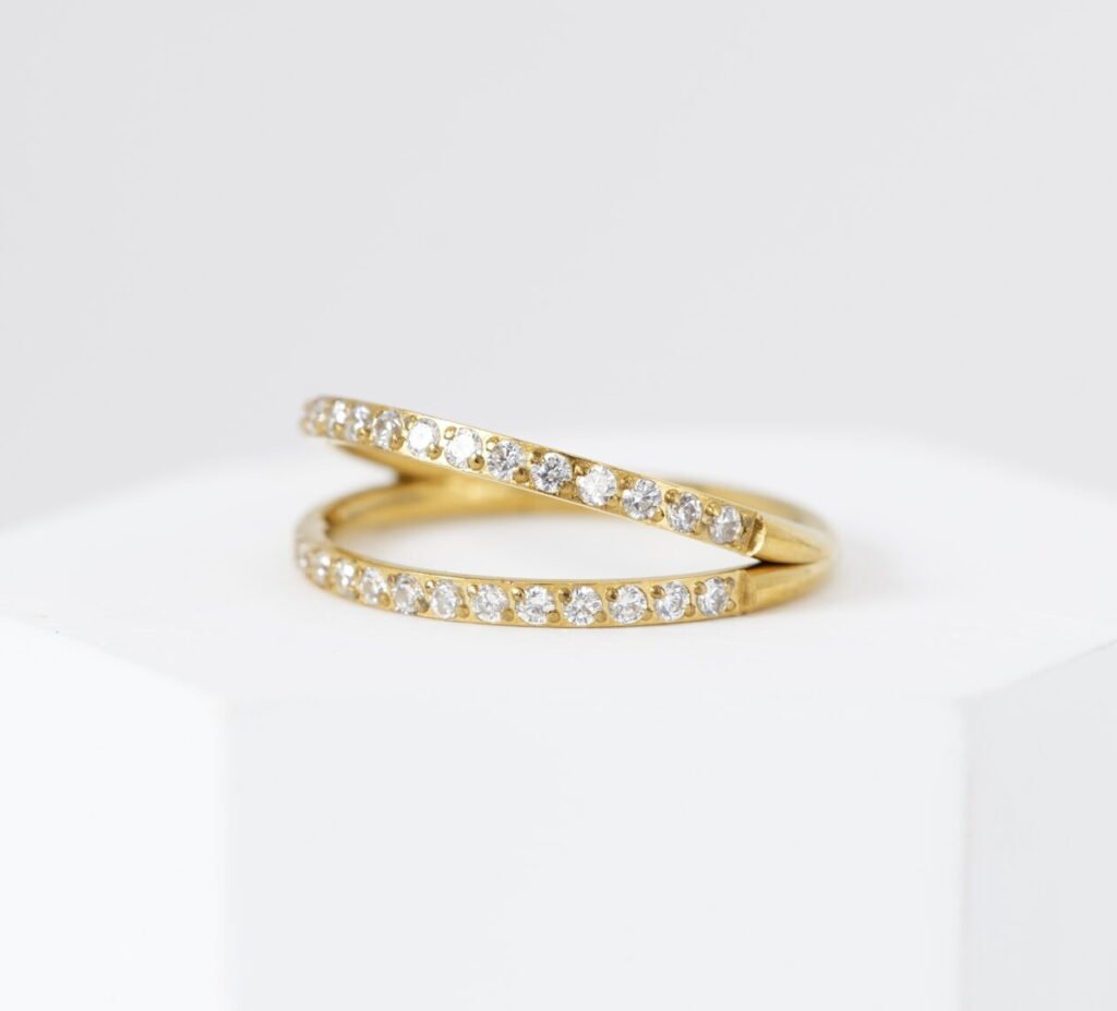 Cliker doble de titanio dorado con zirconias brillantes de 12 mm para piercing